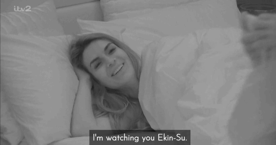 Black and white screenshot of Ekin-Su in bed.