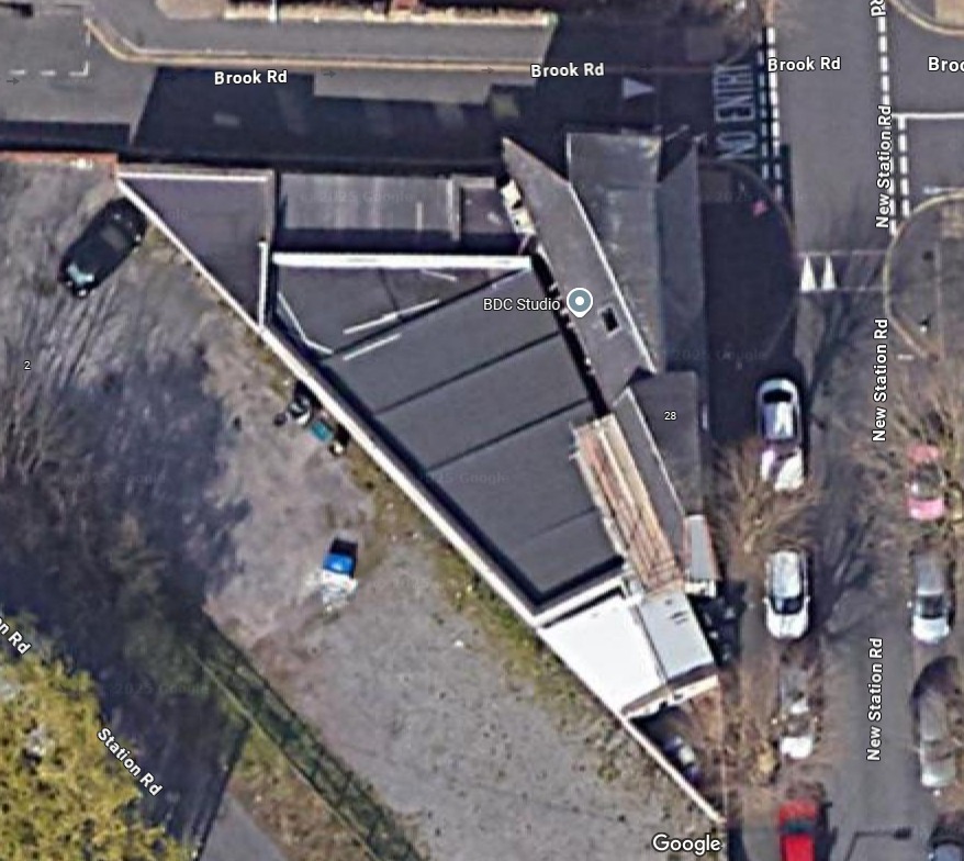 Aerial view of an unusually shaped building labeled "BDC Studio" on New Station Road.