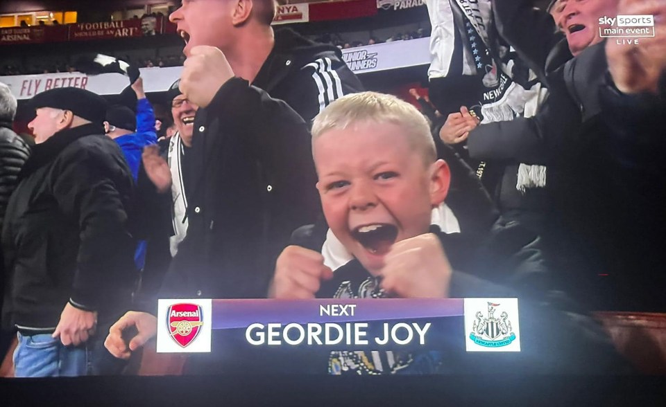 Young Newcastle fan celebrating Arsenal's Carabao Cup win.