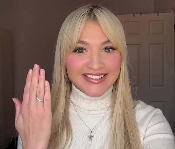 Woman showing off engagement ring, text overlay reads "Married? AGAIN?!" and "AGAIN TO OUR".