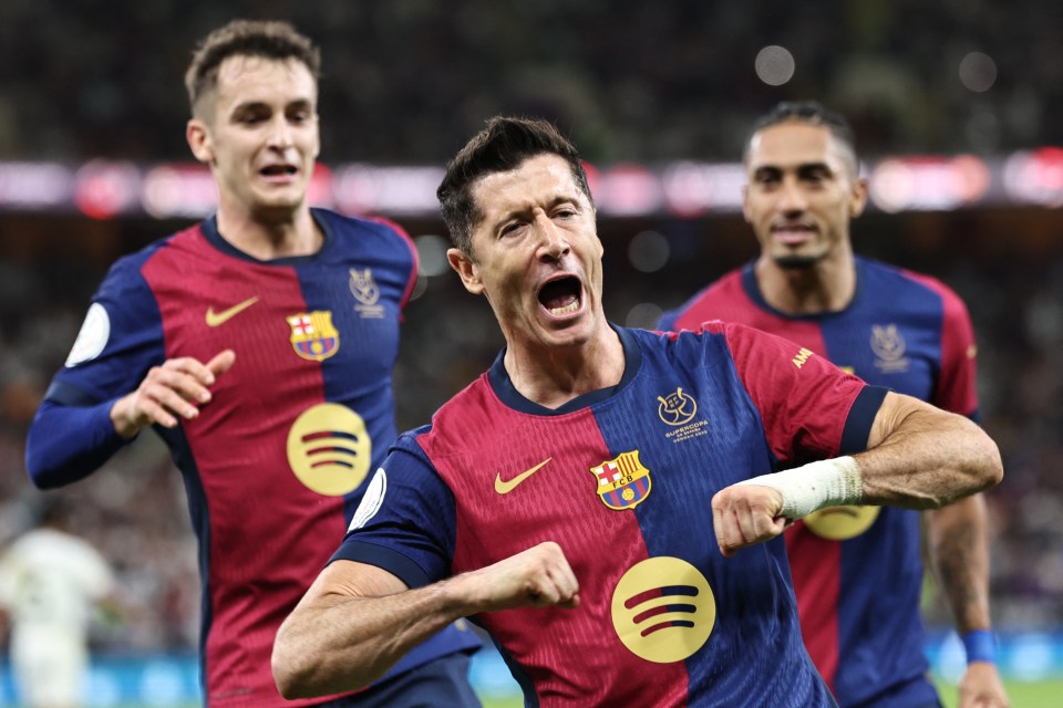 Robert Lewandowski celebrates scoring a goal for FC Barcelona.