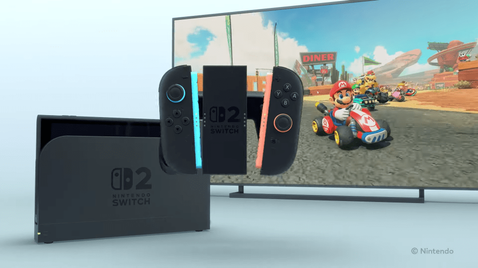 Nintendo Switch 2 model with detached Joy-Con controllers displayed on a TV playing Mario Kart.