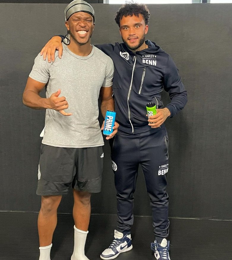 KSI and Harley Benn holding Prime drinks.