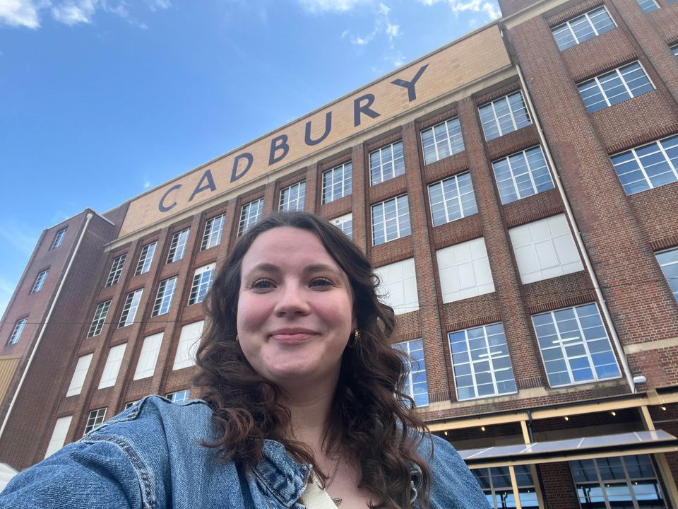 Woman in front of Cadbury factory.