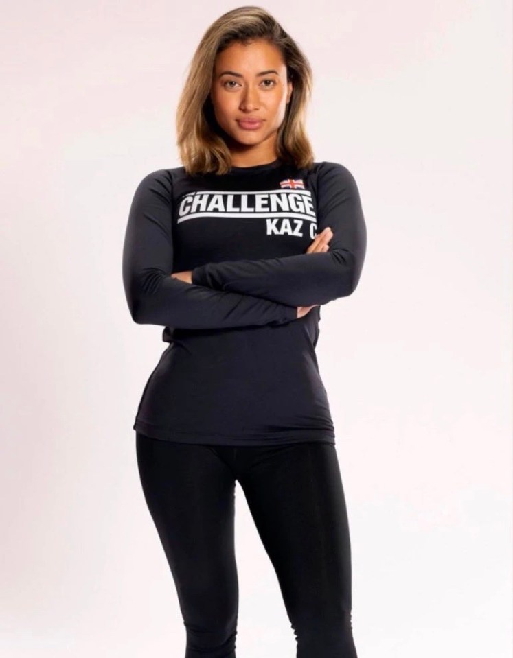 Kaz C, wearing a black long-sleeve shirt with "Challenge" printed on it, arms crossed.