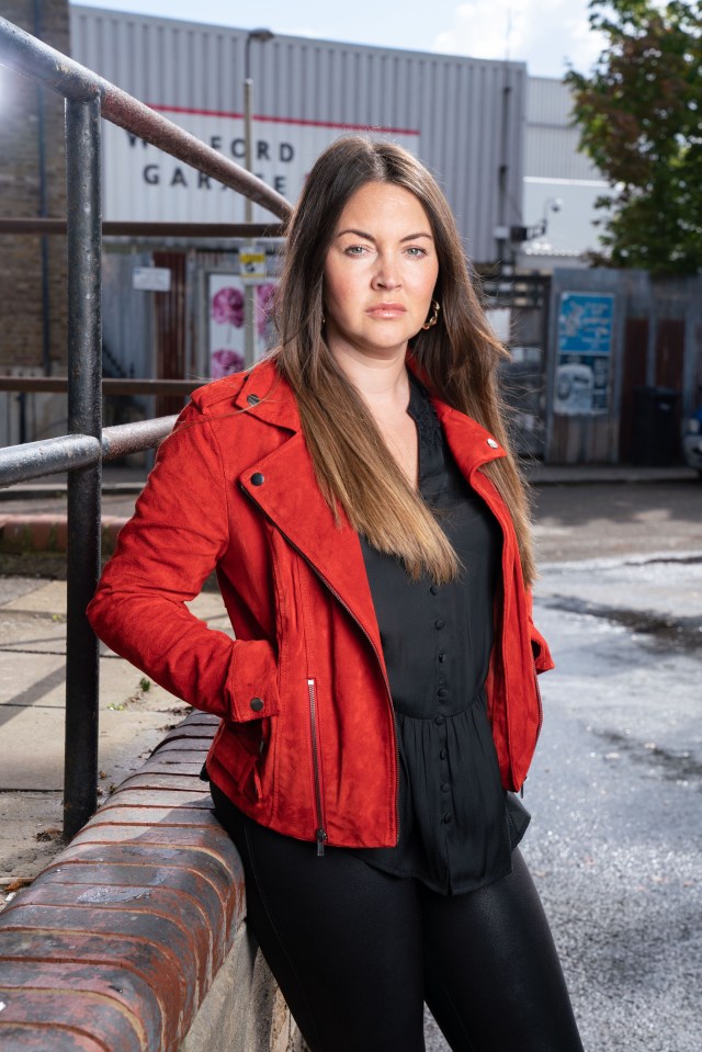 Portrait of Lacey Turner as Stacey Slater in a red jacket.