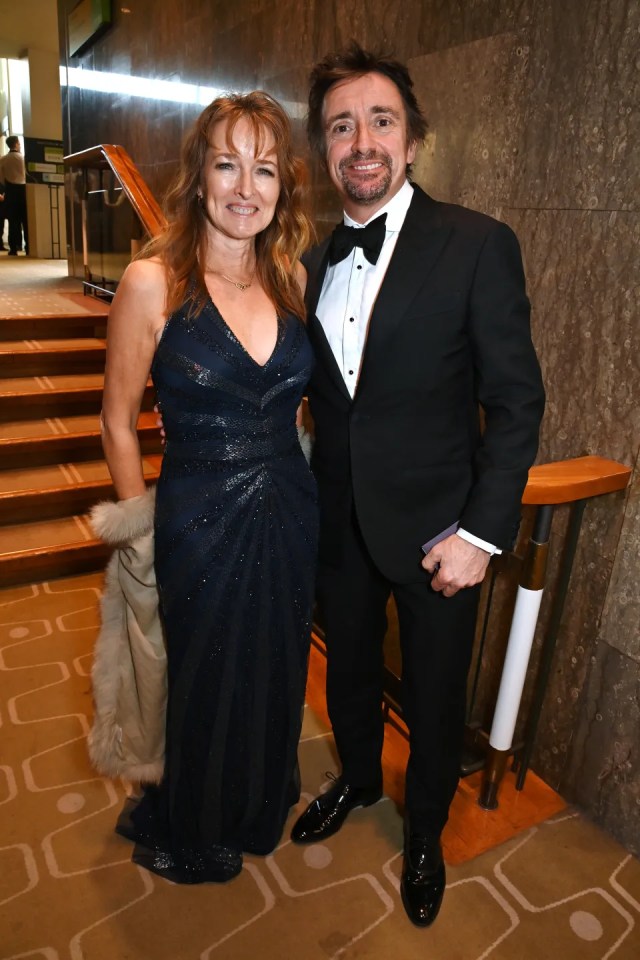 Couple in formal wear at an event.