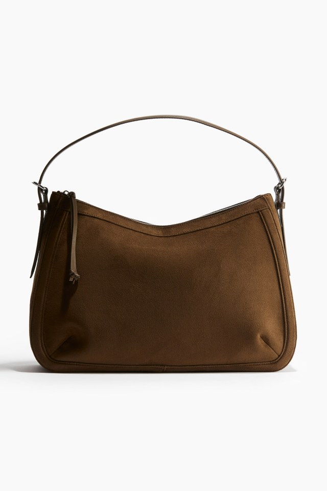 Brown suede hobo bag with a leather strap.