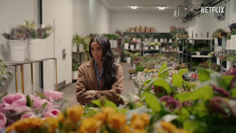 Meghan hand-selecting flowers for creative table arrangements