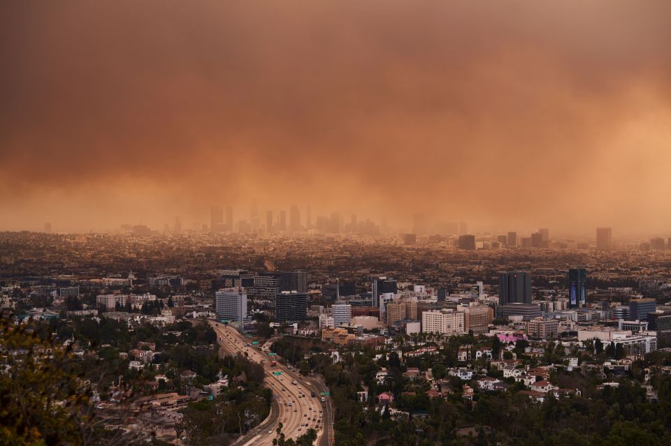 Los Angeles skyline obscured by wildfire smoke.