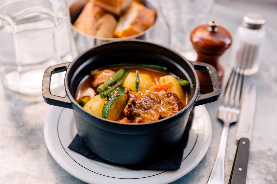 Lamb navarin in a cast iron pot.