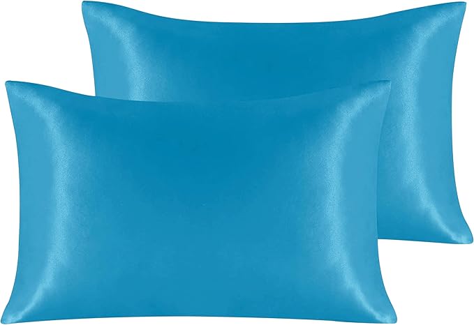 Two teal satin pillowcases.