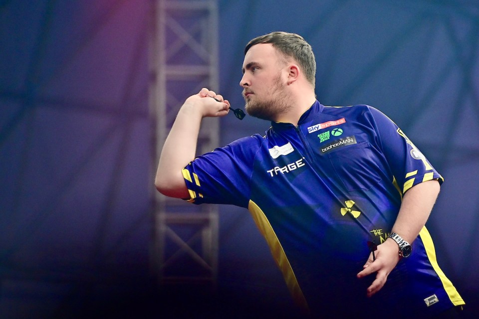 A darts player throwing a dart.