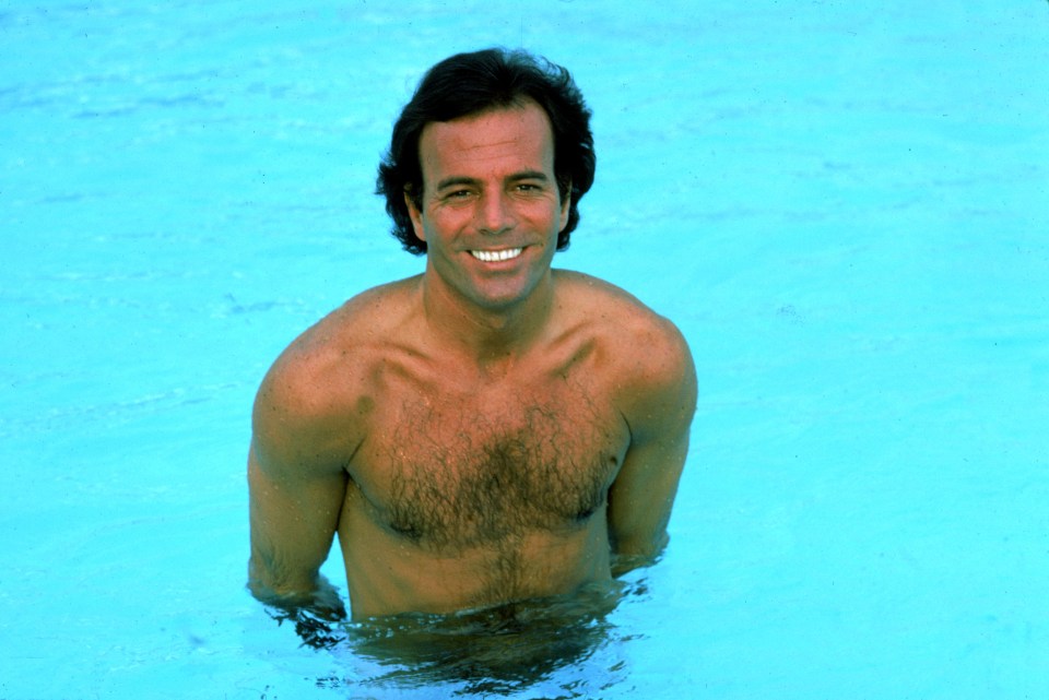 Julio Iglesias in a swimming pool.