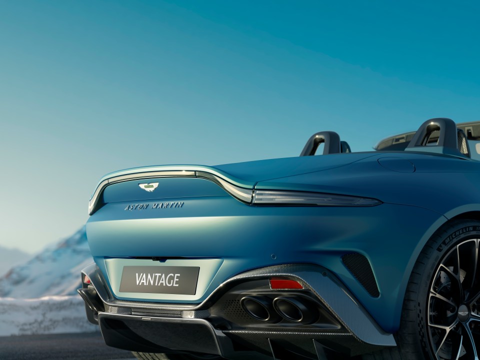 Rear view of a blue Aston Martin Vantage Roadster.