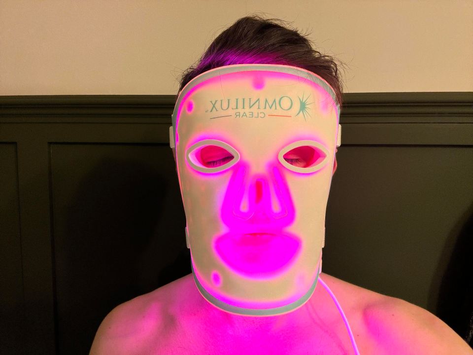 Person wearing an Omnilux Clear mask.