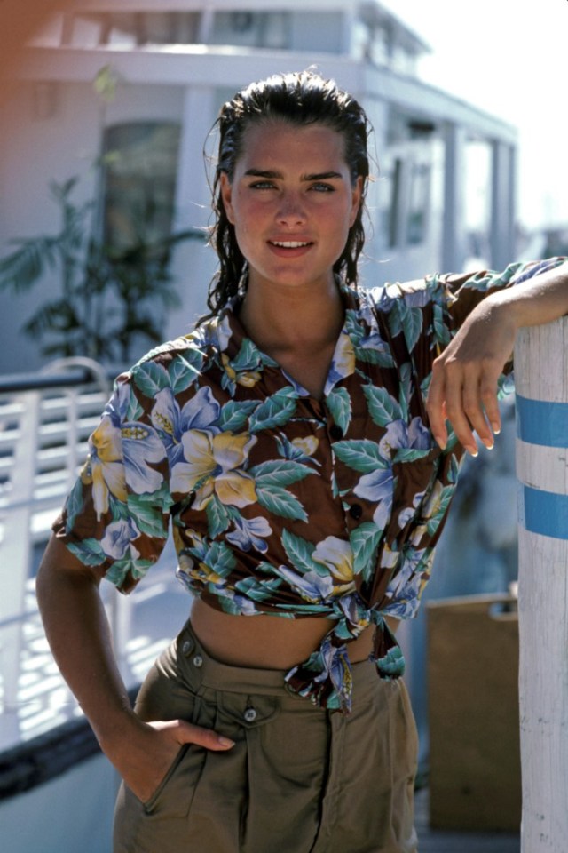 Brooke Shields in a floral shirt and khaki pants.