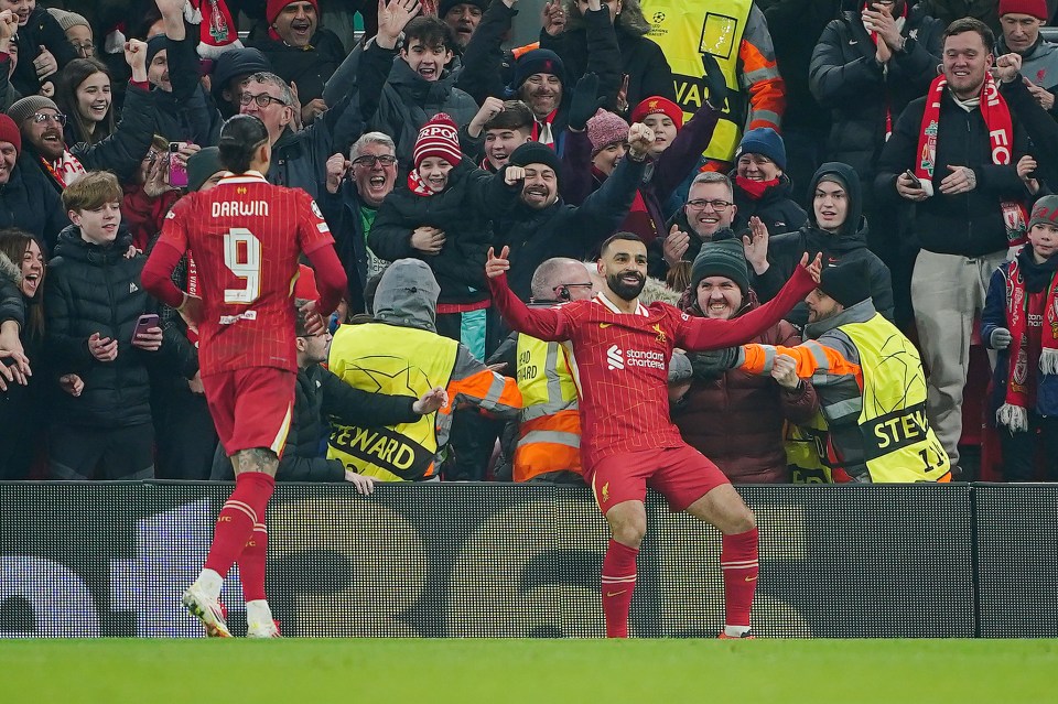 Liverpool's Mohamed Salah (right) celebrates scoring their side's first goal of the game during the UEFA Champions League, league stage match at Anfield, Liverpool. Picture date: Tuesday January 21, 2025. PA Photo. See PA story SOCCER Liverpool. Photo credit should read: Peter Byrne/PA Wire. RESTRICTIONS: Use subject to restrictions. Editorial use only, no commercial use without prior consent from rights holder.