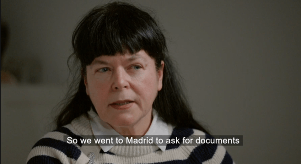 Screenshot of a woman saying, "So we went to Madrid to ask for documents."