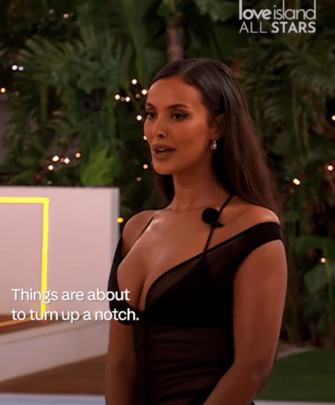 Screenshot of a woman in a black dress on Love Island All Stars, saying "Things are about to turn up a notch."