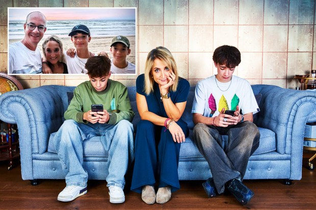 Family on couch, two teens on phones, mother looking concerned, past happy beach photo.