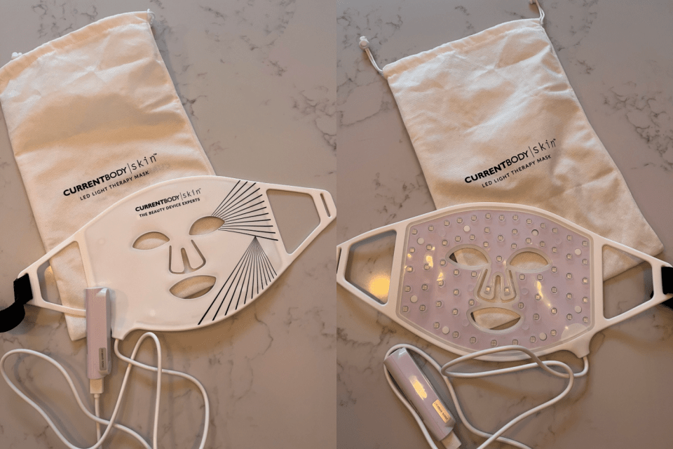 Two CurrentBody skin LED light therapy masks with their respective carrying pouches and controllers.