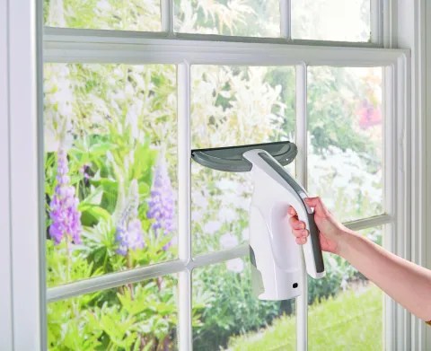 Electric window cleaner in use.