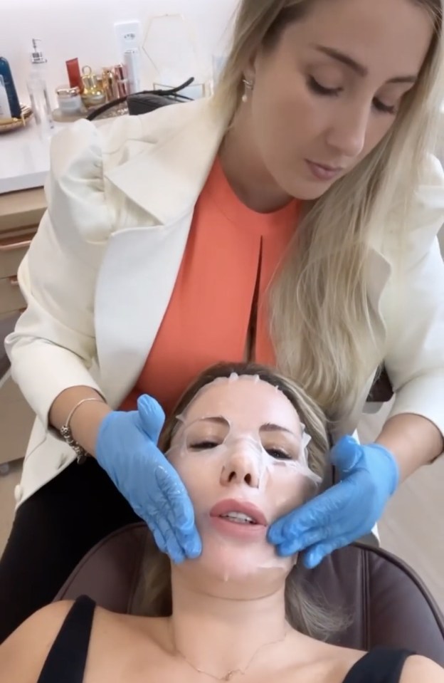 A woman receiving a facial treatment.