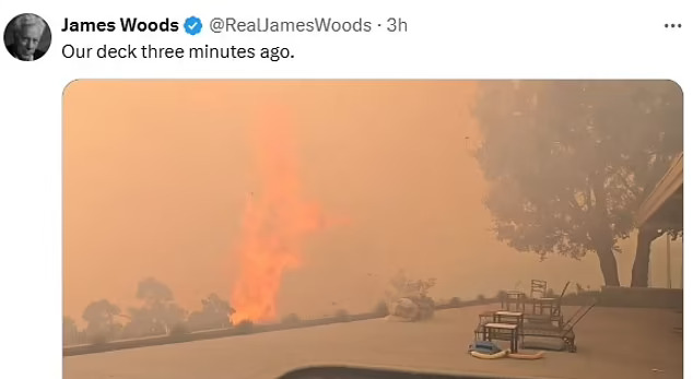 Photo of a wildfire approaching a deck with patio furniture.