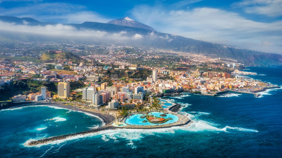 Aerial view of Puerto de la Cruz, Tenerife, with Mount Teide in the background.