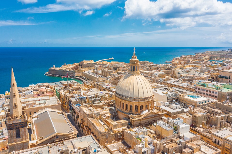 Aerial view of the Lady of Mount Carmel church and St. Paul's Cathedral in Valletta, Malta.