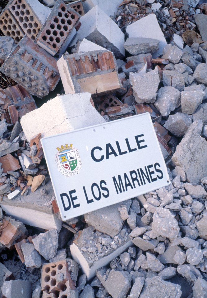 Calle de los Marines street sign in rubble.