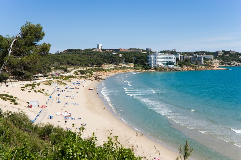 Platja Llarga beach in Salou, Spain, with Hotel Negresco Princess in the background.