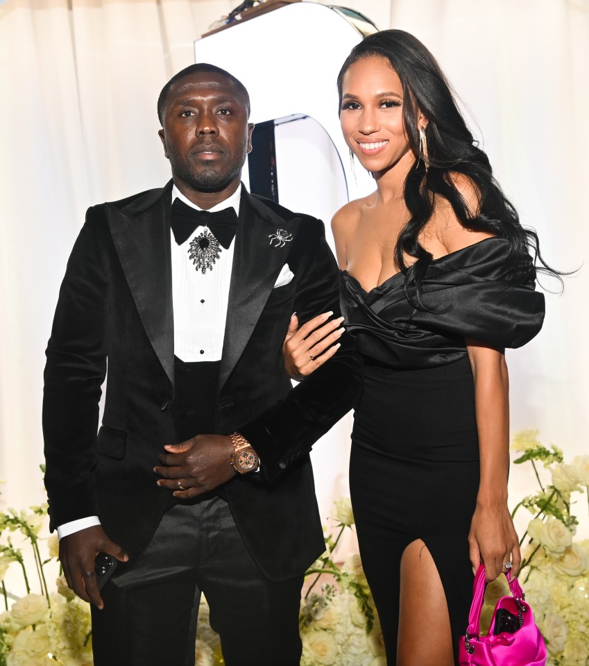 Andre Berto and a woman in formalwear at an event.