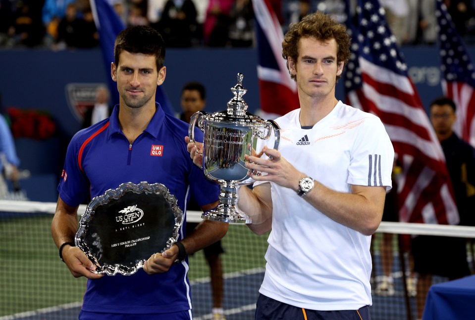 Andy Murray and Novak Djokovic with the US Open trophy.