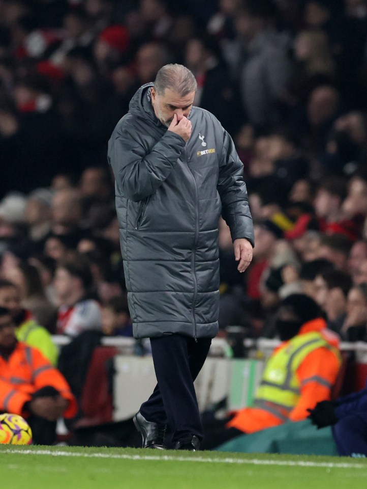 Ange Postecoglou, Tottenham Hotspur manager, looking down during a match.