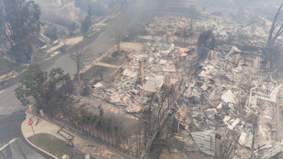 Aerial view of a home destroyed by wildfire.