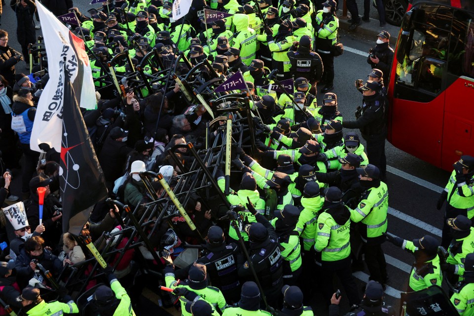 Anti-Yoon protesters clash with police officers after the attempted arrest