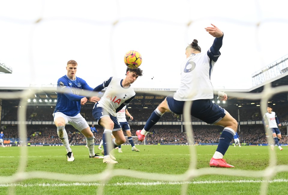 Soccer player heading the ball during a game.