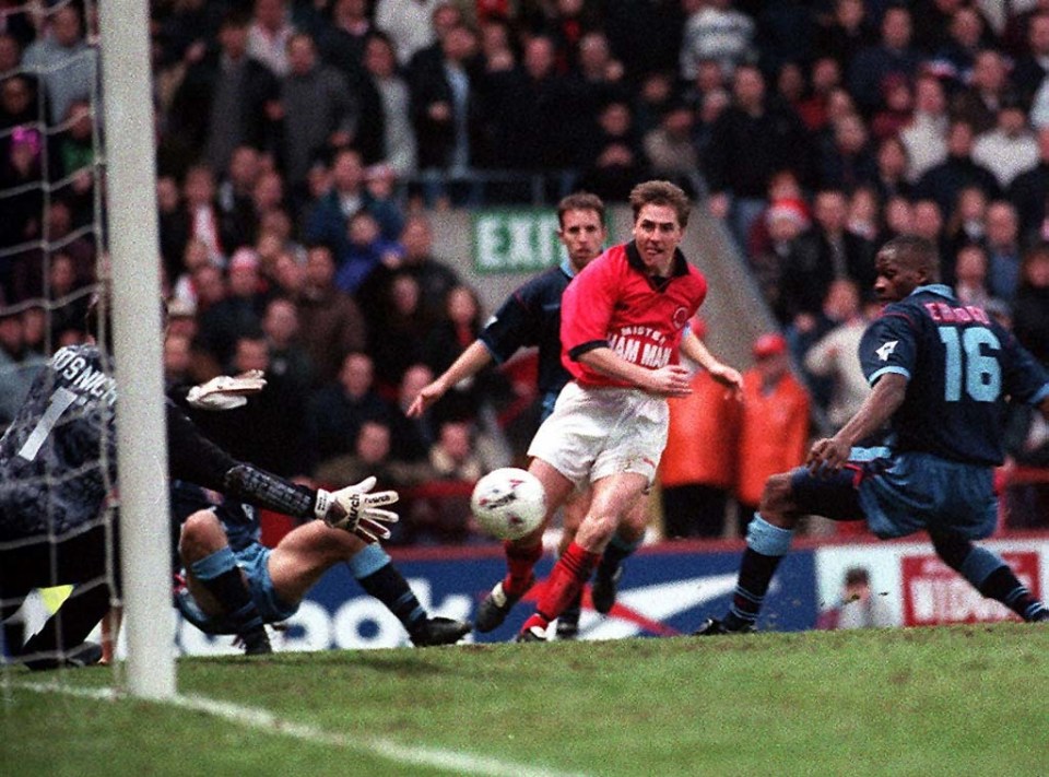 Aston Villa goalkeeper Mark Bosnich making a save.