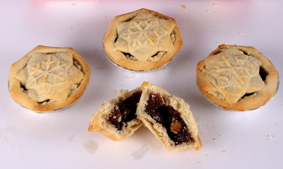 Mr. Kipling mince pies in a box and on a surface.