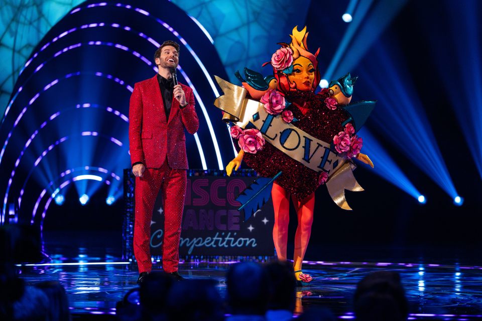 Joel Dommett and the Tattoo Heart contestant on The Masked Singer.