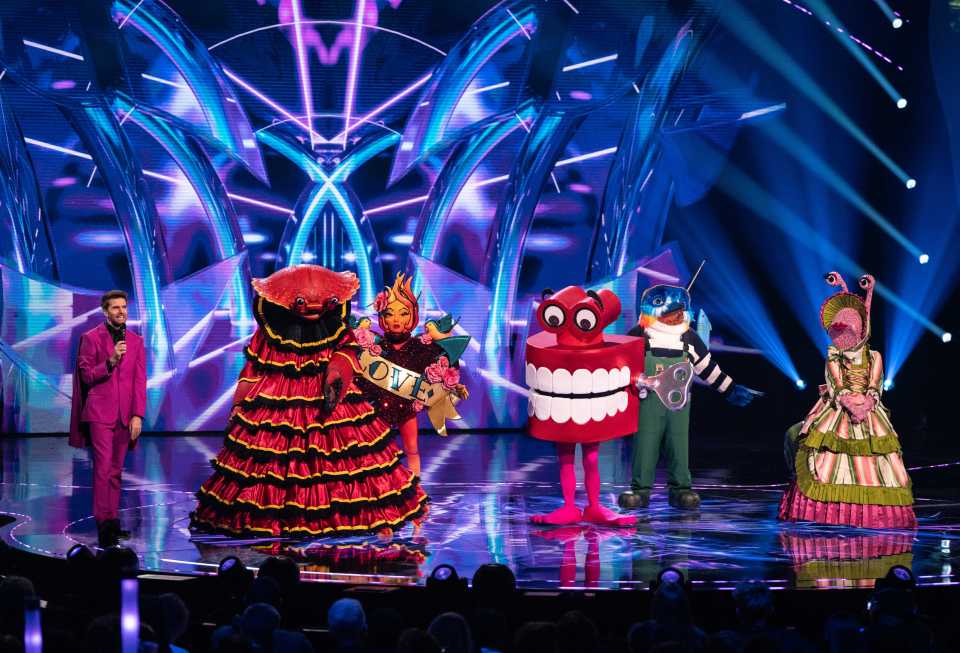 Masked Singer contestants: Crab, Fire, Teeth, Kingfisher, and Snail.