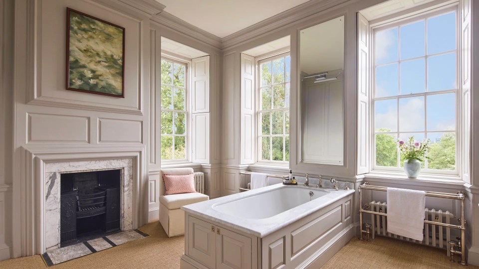 Take in the views while soaking in the marble-topped bath