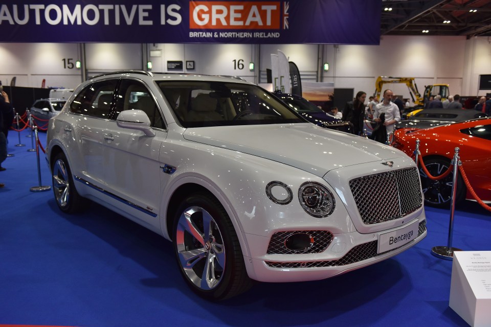 White Bentley Bentayga Hybrid on display.