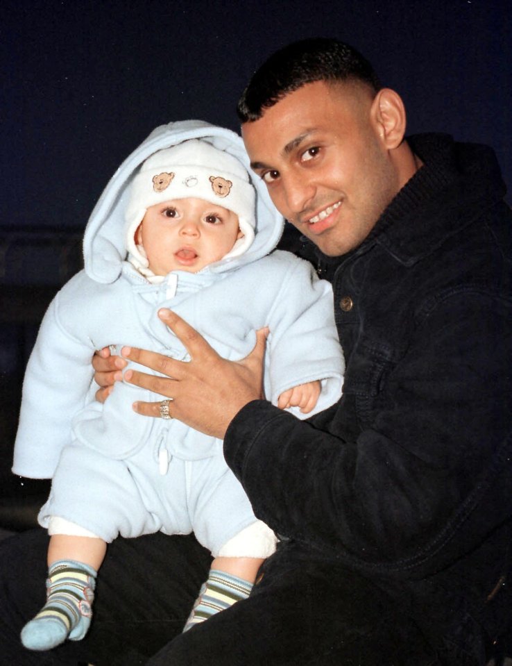 Prince Naseem Hamed holding his baby son.