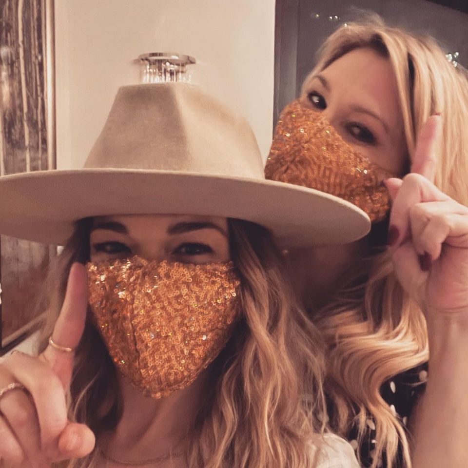 Brandi Glanville and LeAnn Rimes wearing sequined face masks.