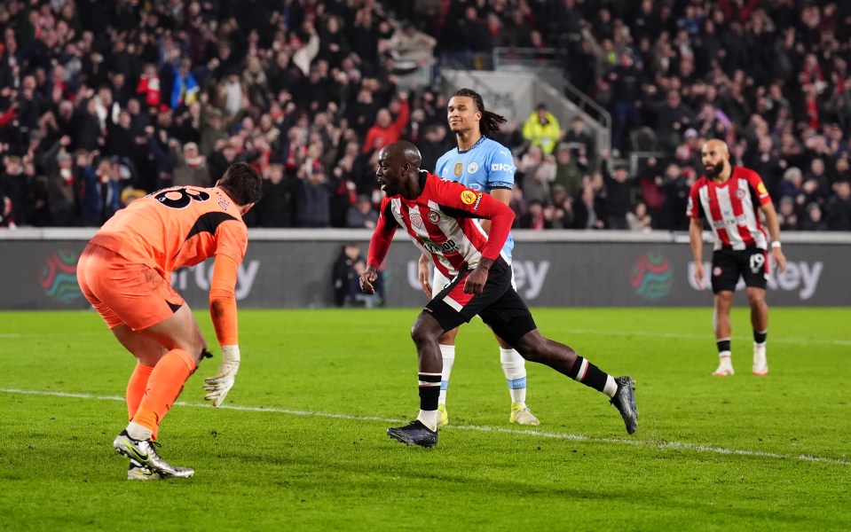 Yoane Wissa celebrating a goal during a soccer match.