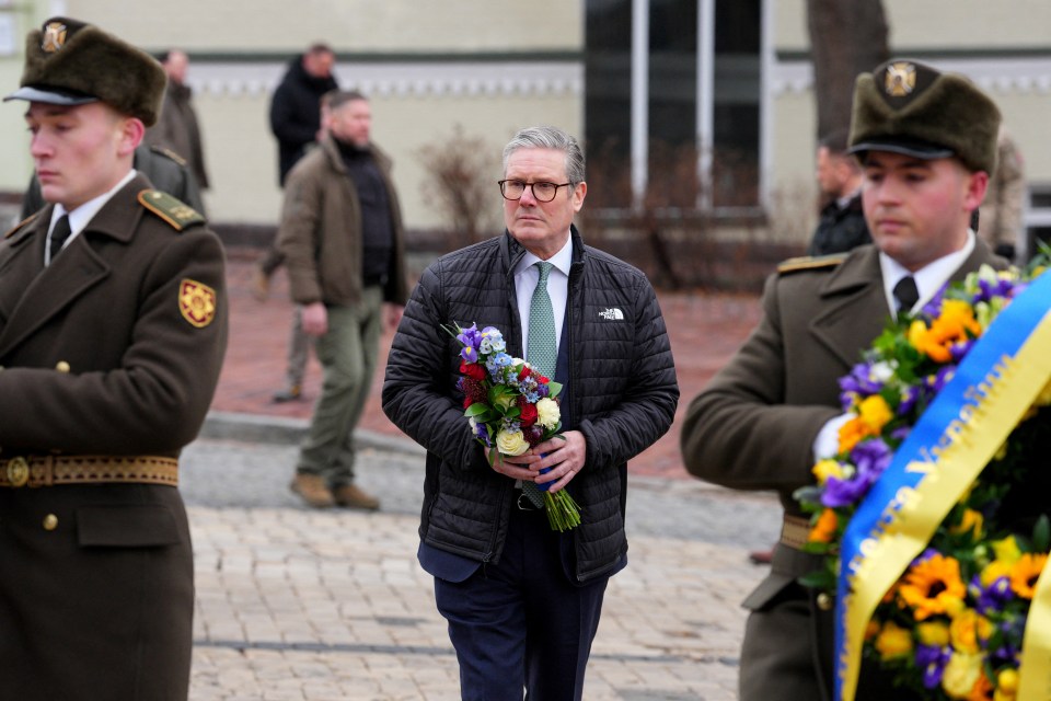 Keir Starmer laying a wreath at a memorial in Kyiv.