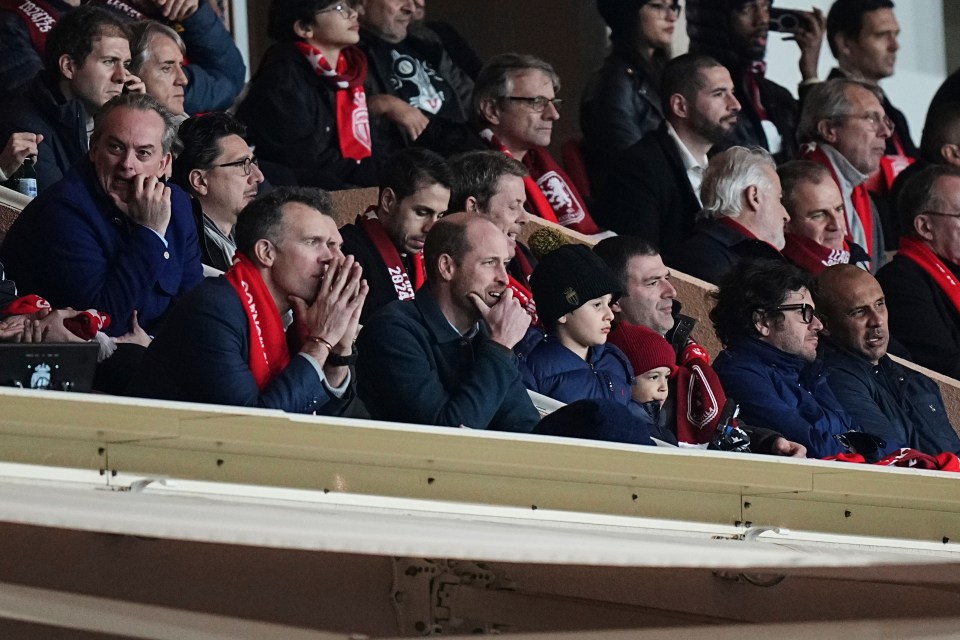 Prince William watching a soccer match.